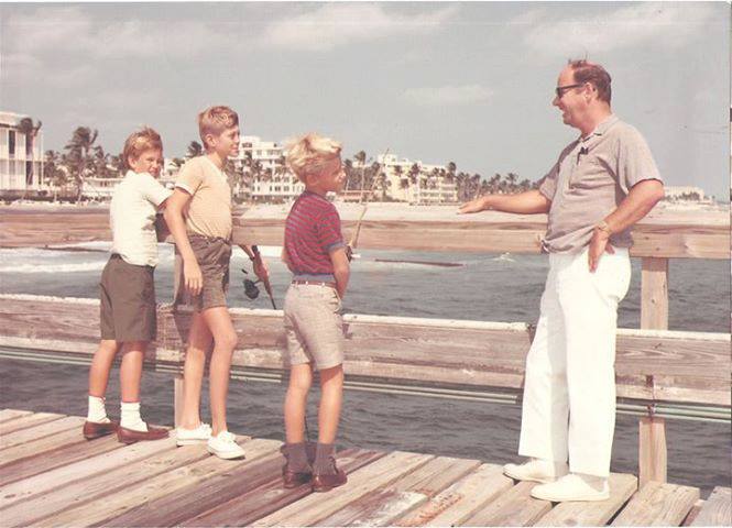 Charley Carvin with his children, Chris and James and a friend on the Palm Beach Pier before the Town had it raised.